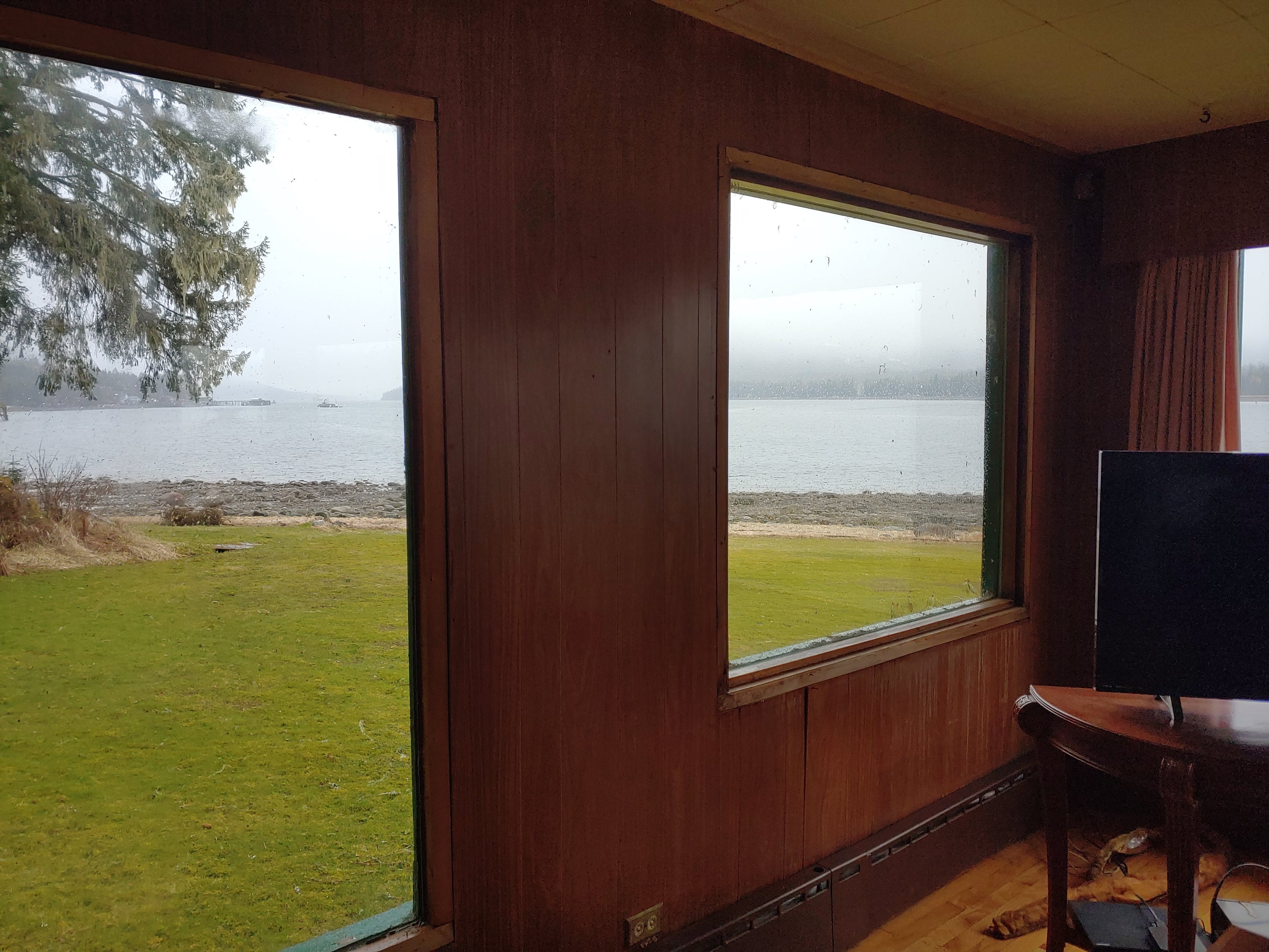 inside a room with wood-paneled walls