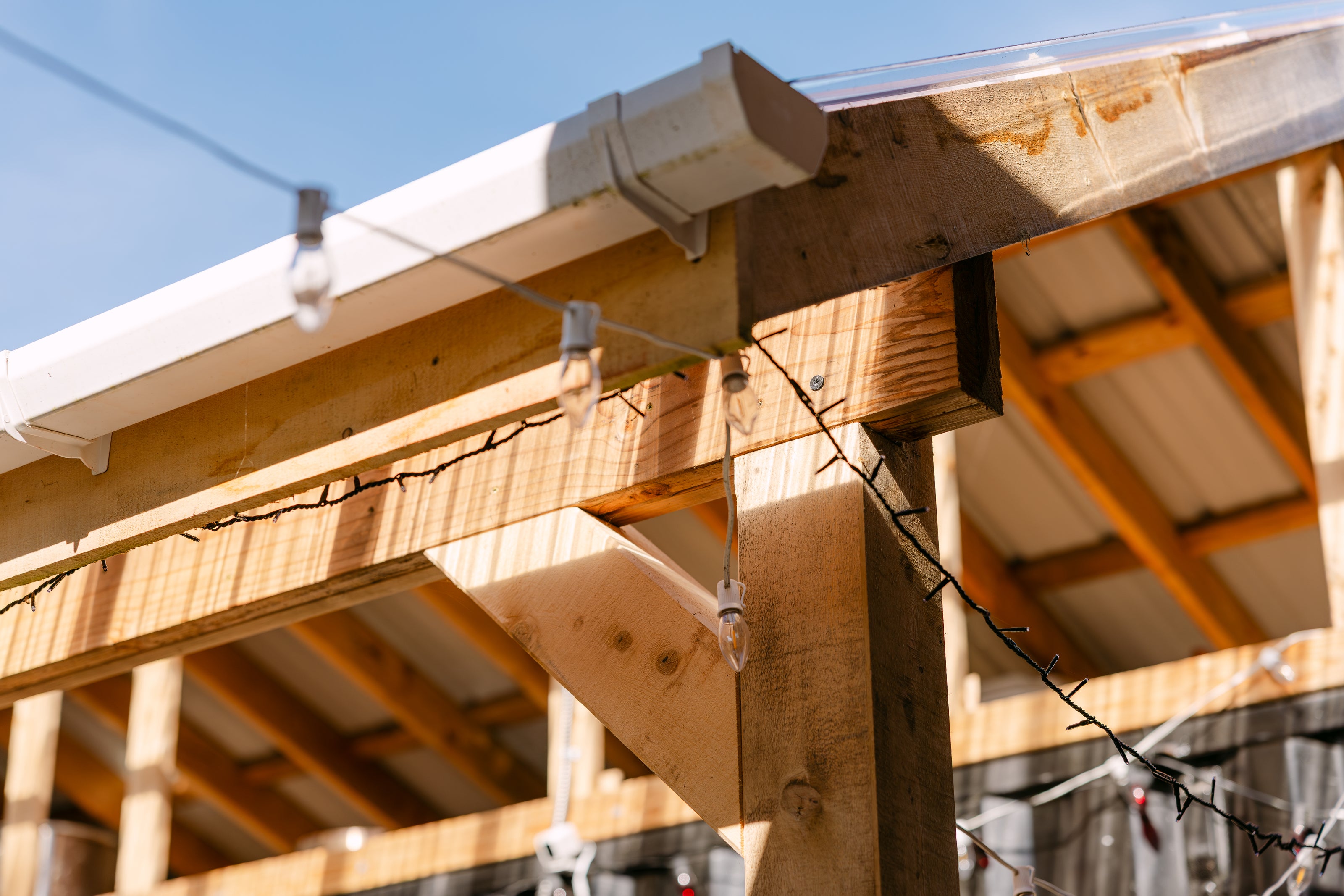 LED string lights along the wooden beams 
