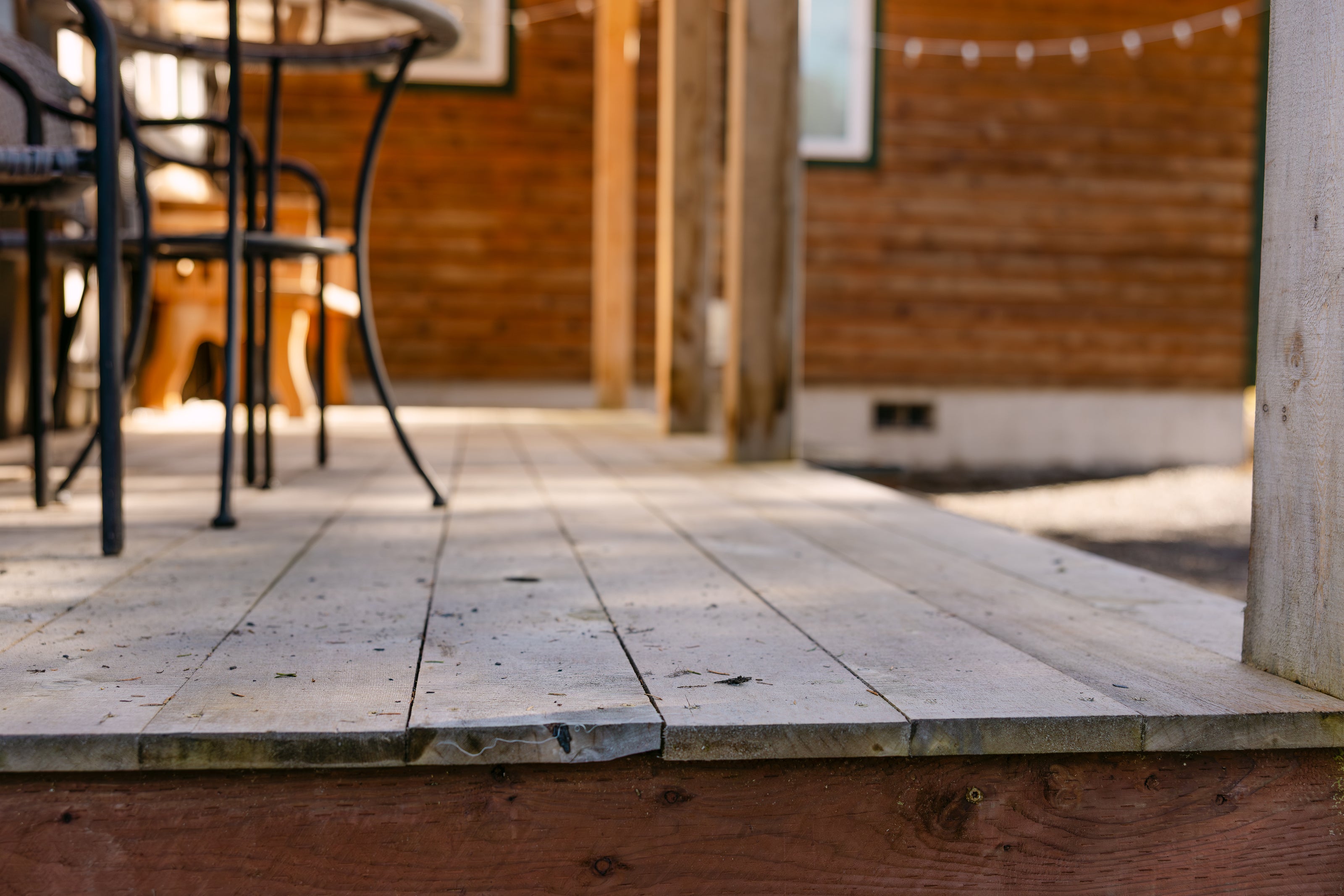 wooden porch attached with wooden siding