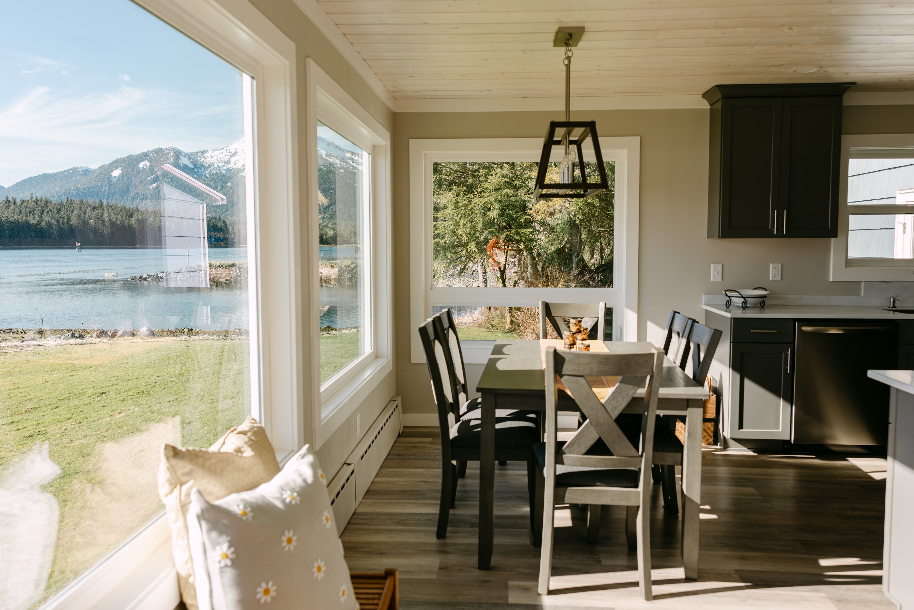 Modern dining room with lake view and natural sunlight