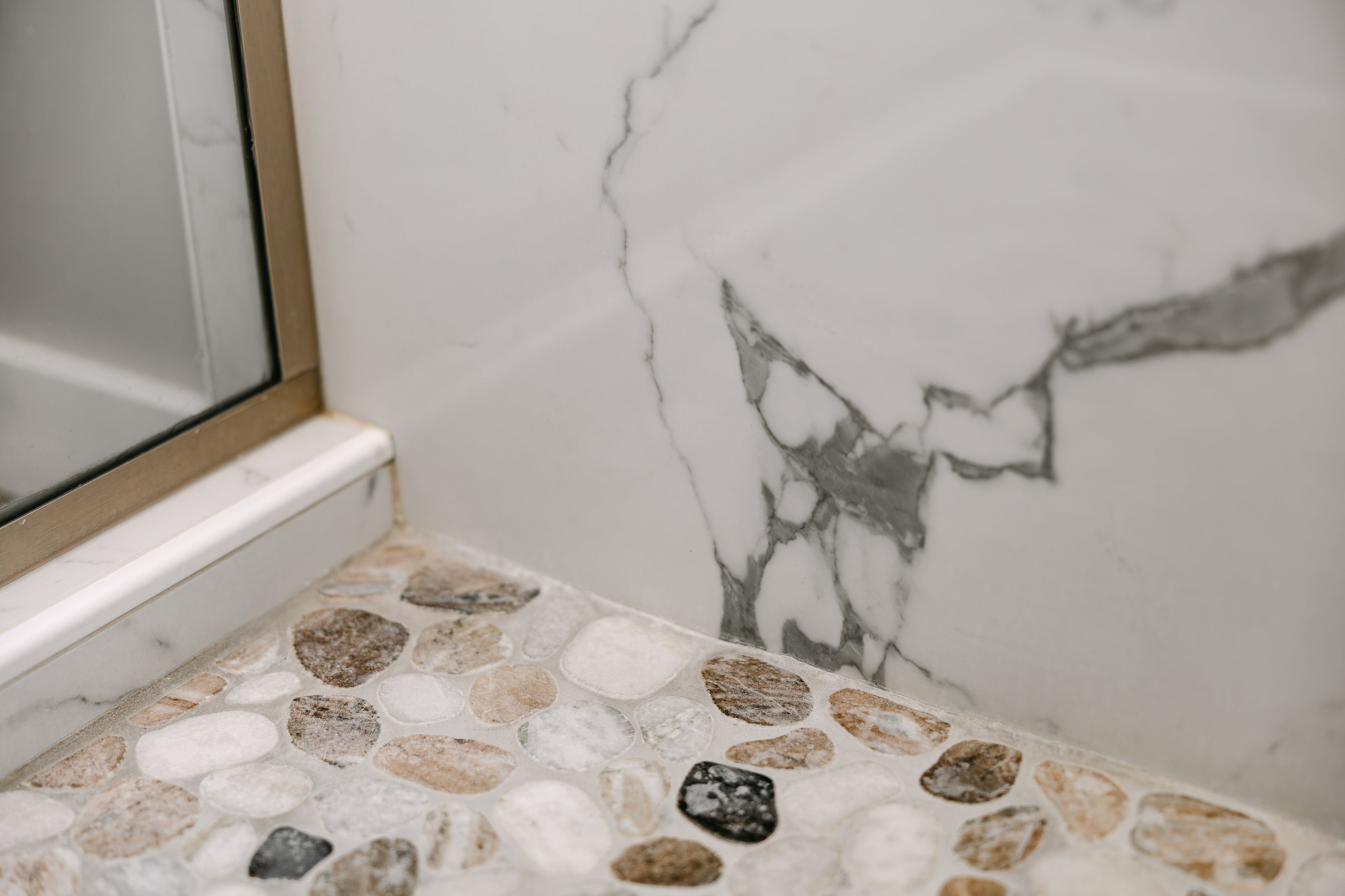 view of a stylish bathroom flooring and wall