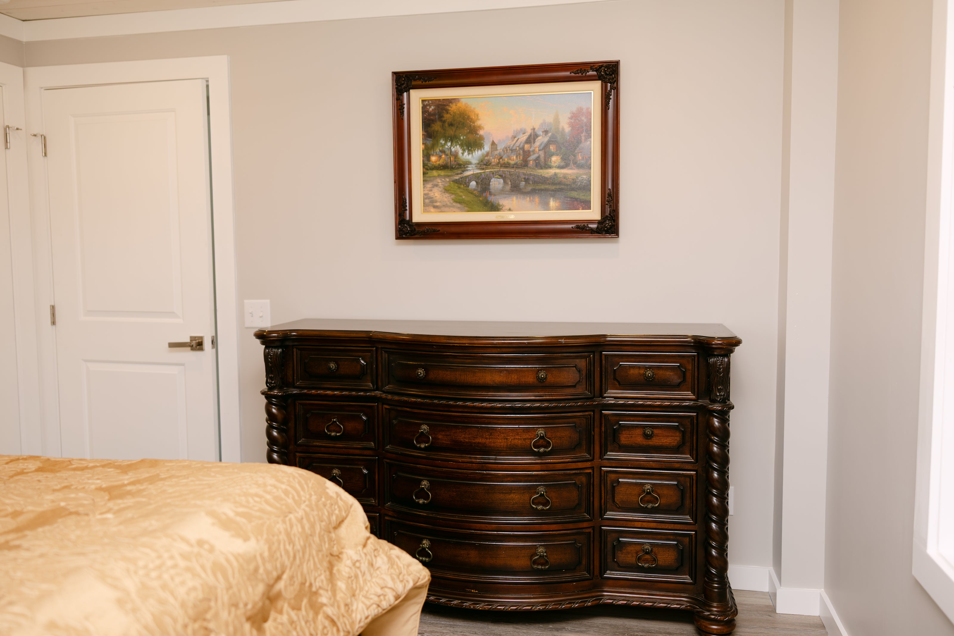 stylish bedroom with dark wooden dresser 