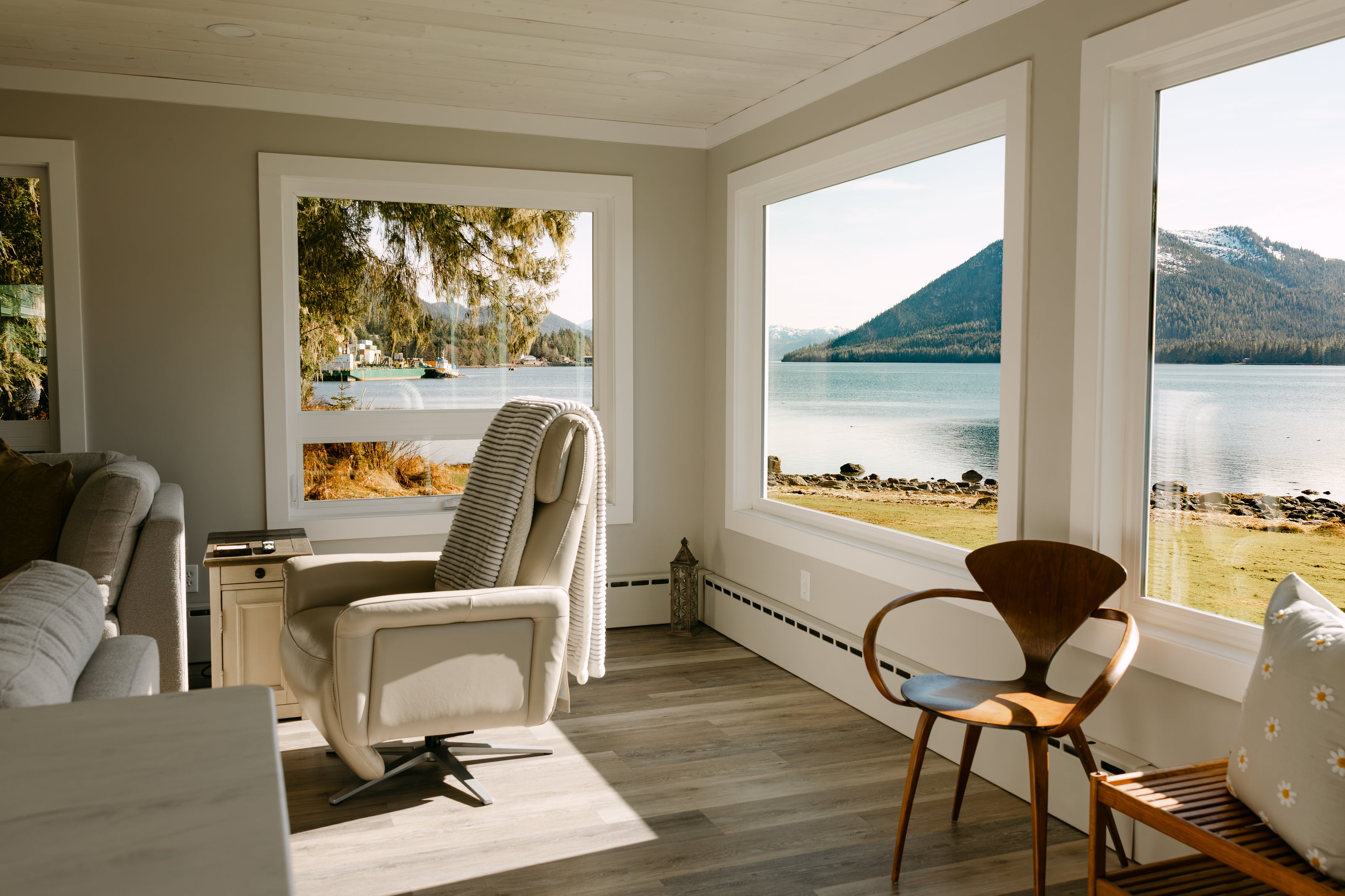 bright room with large windows offering mountainous views  