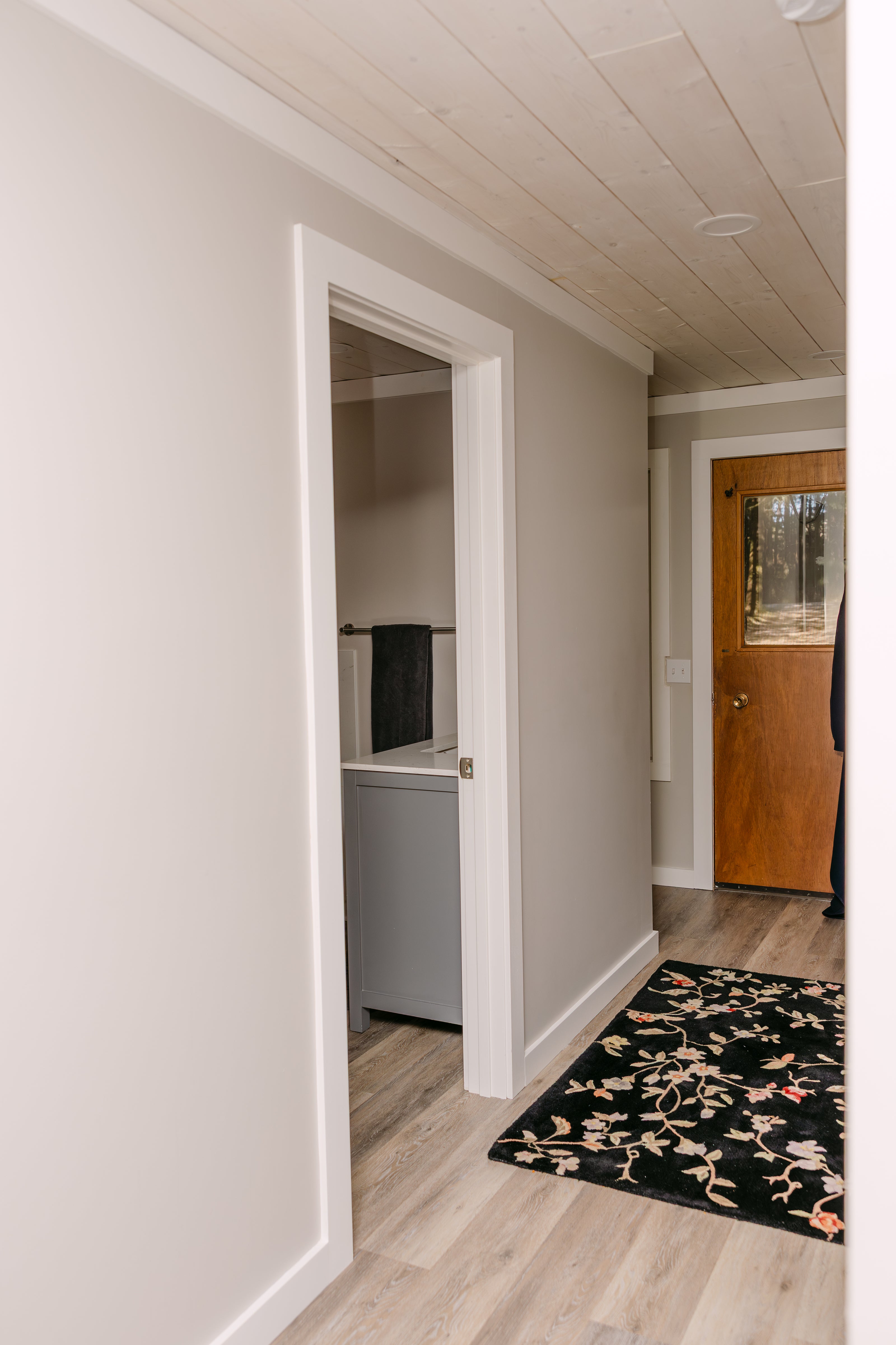 bright, modern interior hallway with light-colored walls