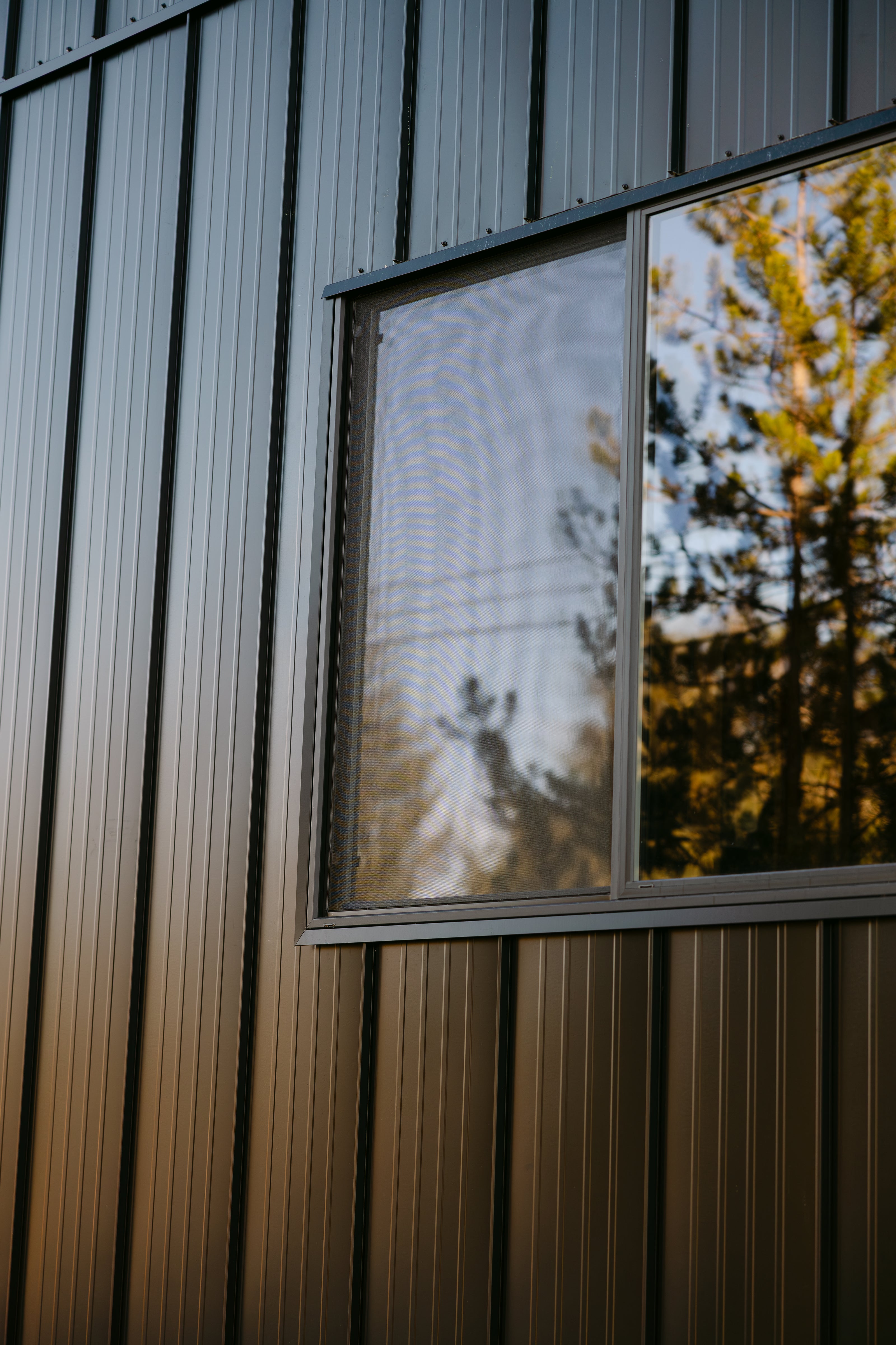 metal wall with glass window 